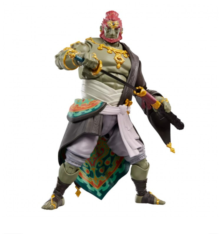 Hasbro Heroes of Hyrule Ganondorf action figure with, grey and white garments, and gold accents, posed against a plain white background.