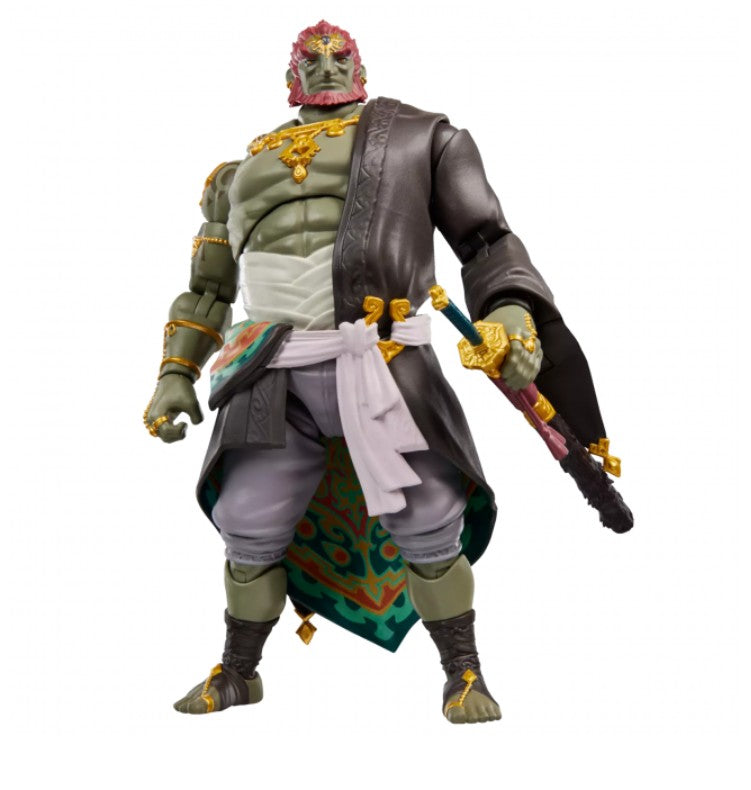 Hasbro Heroes of Hyrule Ganondorf action figure, wearing a dark brown robe, white sash, and patterned green and blue fabric, holding a sword, isolated on a white background.