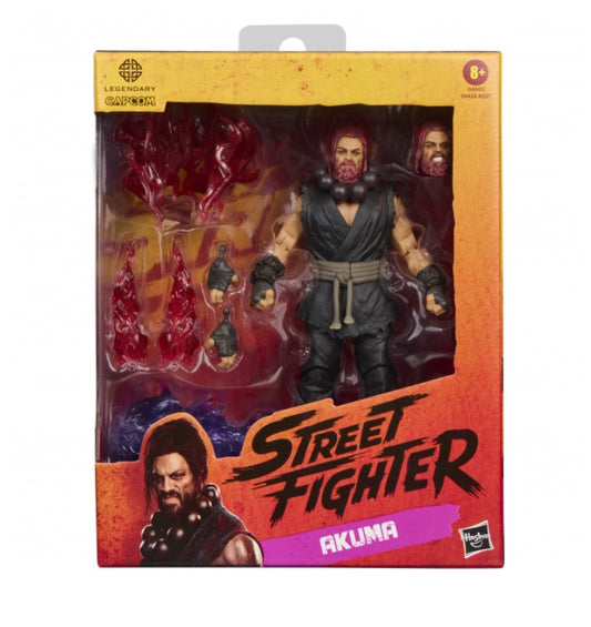 Hasbro Street Fighter Legends Akuma action figure in its original window box packaging, featuring interchangeable heads and bloody hand accessories.