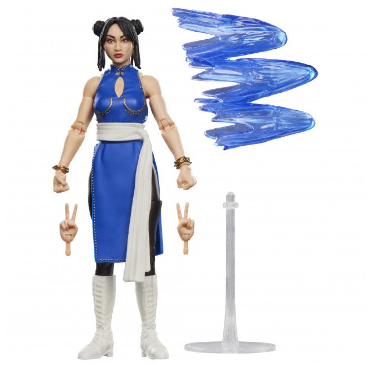 A Street Fighter Chun-Li action figure shown on a white background with an extra blue arm accessory and a clear stand.