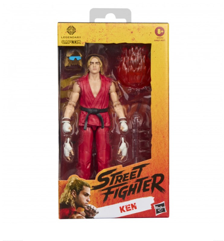 Hasbro Street Fighter Ken action figure in its original window box packaging, featuring Ken in a red gi with a black belt and accessories visible through the clear front window.