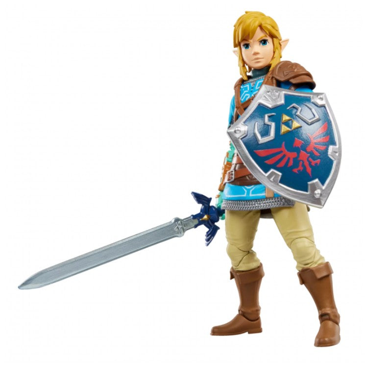 A Link action figure holding a silver sword and a blue shield with a red trident emblem, set against a plain white background.