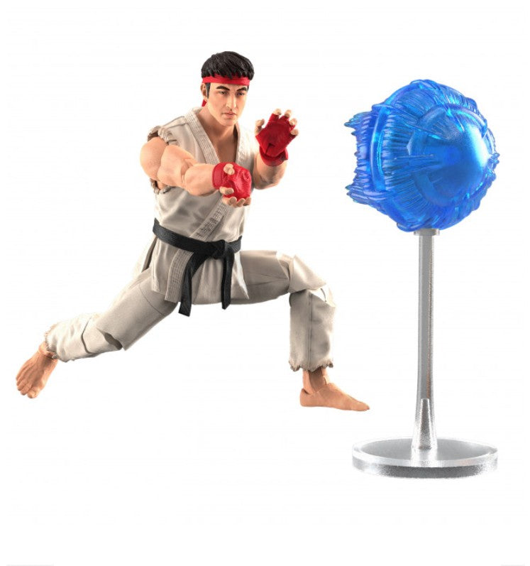 A Street Fighter Ryu action figure posed mid-kick toward a translucent blue energy ball on a silver stand, against a plain white background.