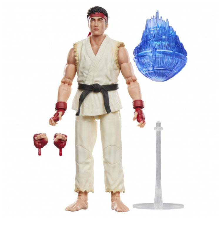 A Street Fighter 6 action figure of Ryu, shown standing on a white background with accessories including an alternate pair of hands, a blue translucent energy ball, and a clear stand.
